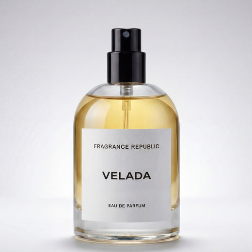 Clear glass bottle of Velada eau de parfum with black atomizer and minimalist label