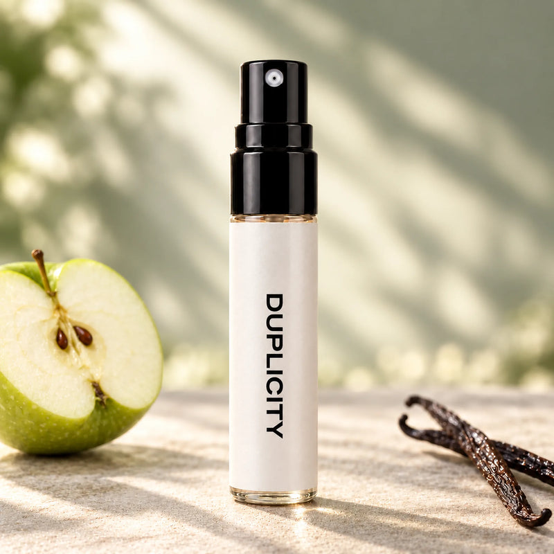 Fragrance Republic Duplicity 5ml perfume sample spray beside a green apple and vanilla pods.