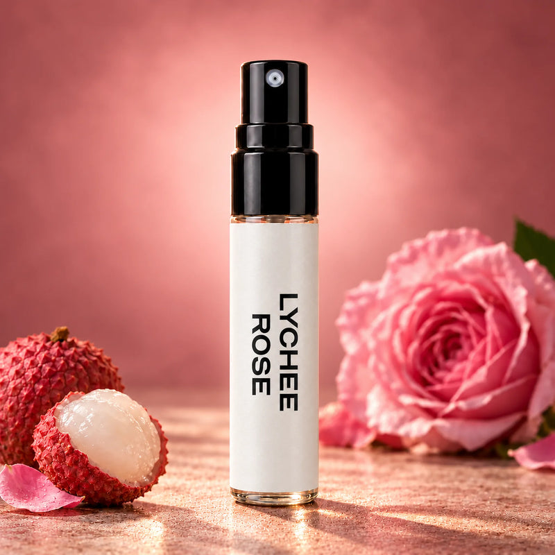 Fragrance Republic Lychee Rose 5ml perfume sample spray beside lychee and a pink rose.