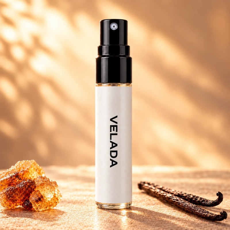 Fragrance Republic Velada 5ml perfume sample spray beside amber-coloured resin and vanilla pods.