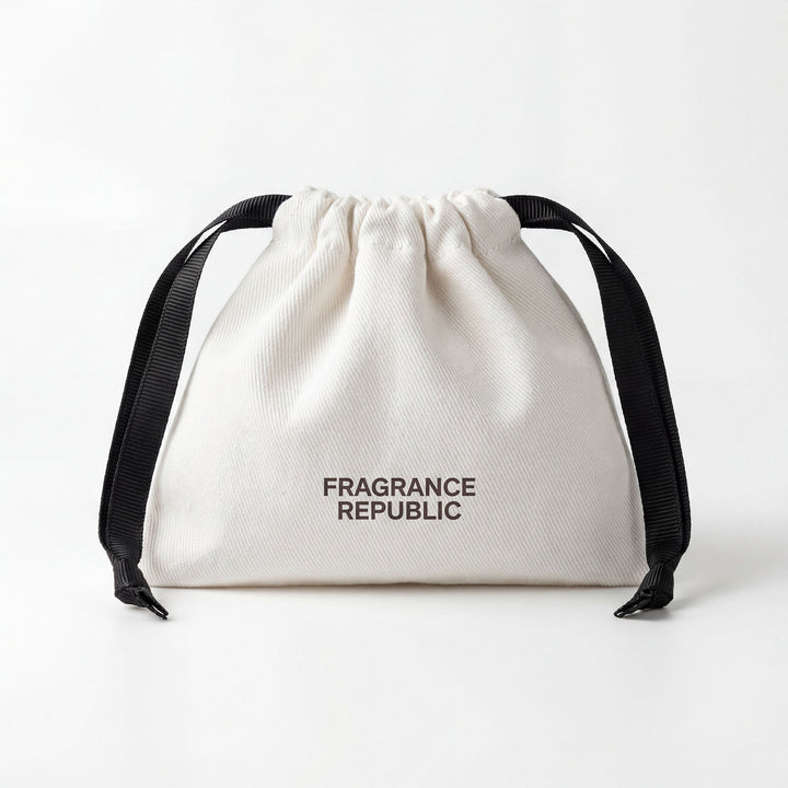 White drawstring pouch with black ribbons and 'Fragrance Republic' text on front.