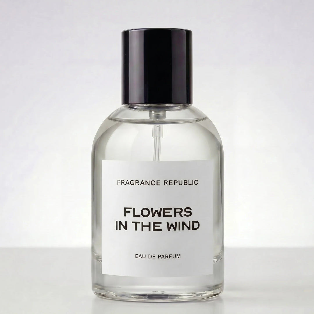 Clear perfume bottle labeled 'Flowers in the Wind' by Fragrance Republic on a white background
