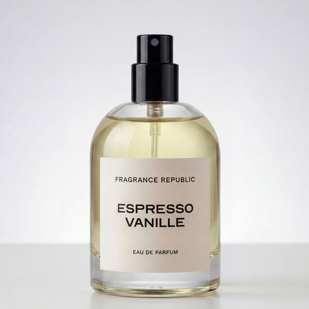 Clear glass bottle of Espresso Vanille eau de parfum with black spray cap on white background.