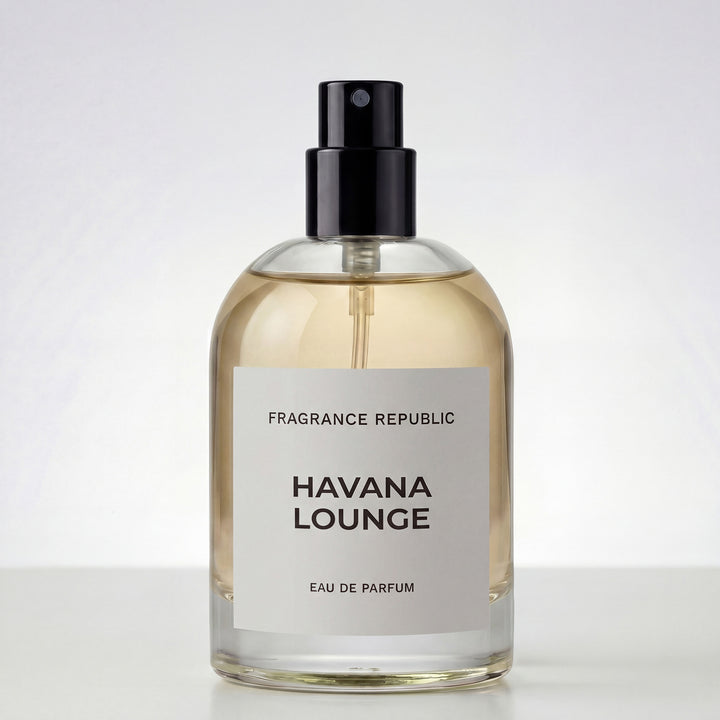 Clear glass bottle of Havana Lounge eau de parfum with black spray top on white background
