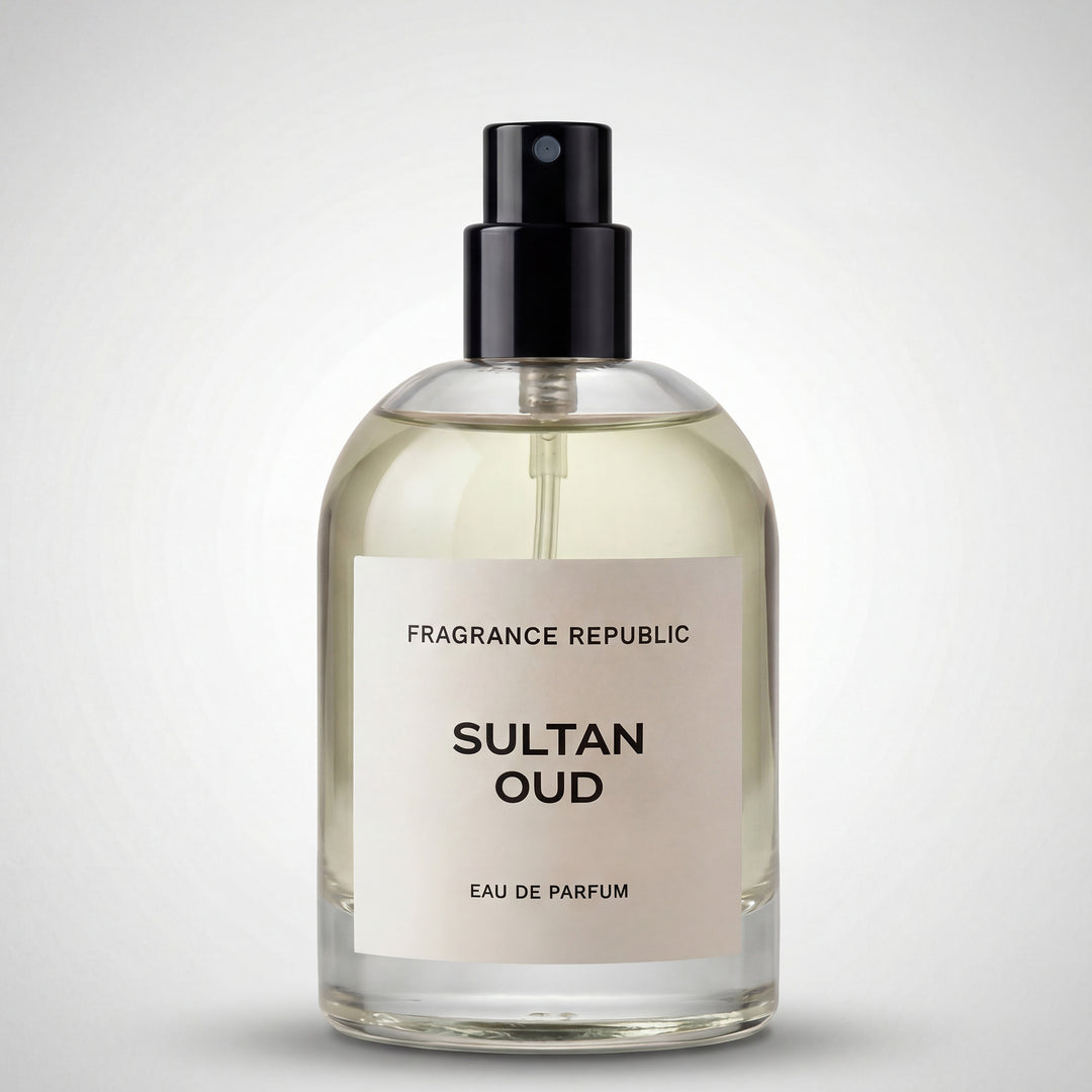 Clear glass bottle of Sultan Oud eau de parfum with black spray cap on a light background.