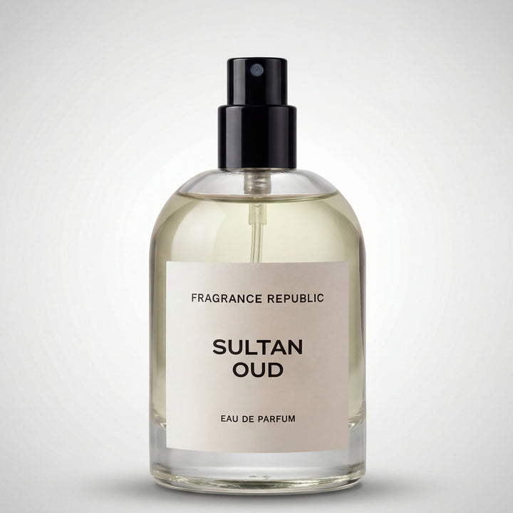 Clear glass bottle of Sultan Oud eau de parfum with black spray cap on a light background.