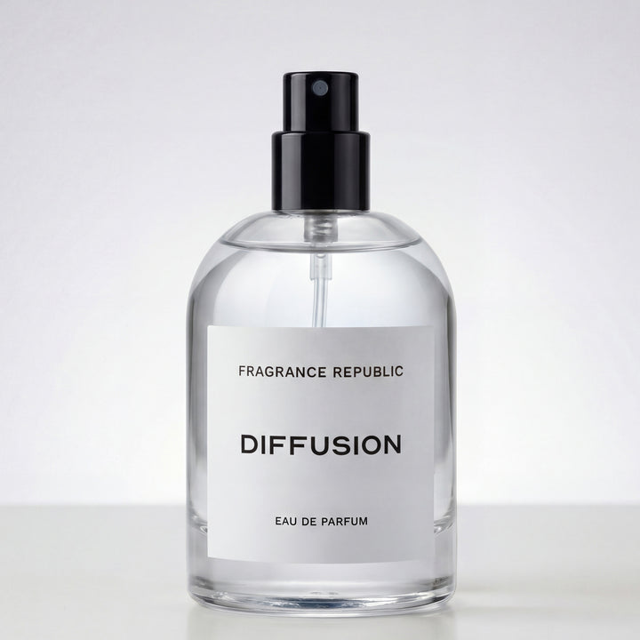 Clear glass bottle of Diffusion Eau de Parfum with black spray top and minimalist label