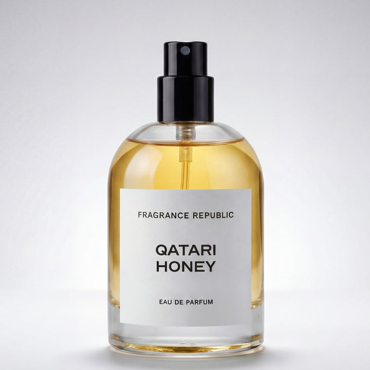 Clear Qatari Honey eau de parfum spray bottle with golden liquid on white background