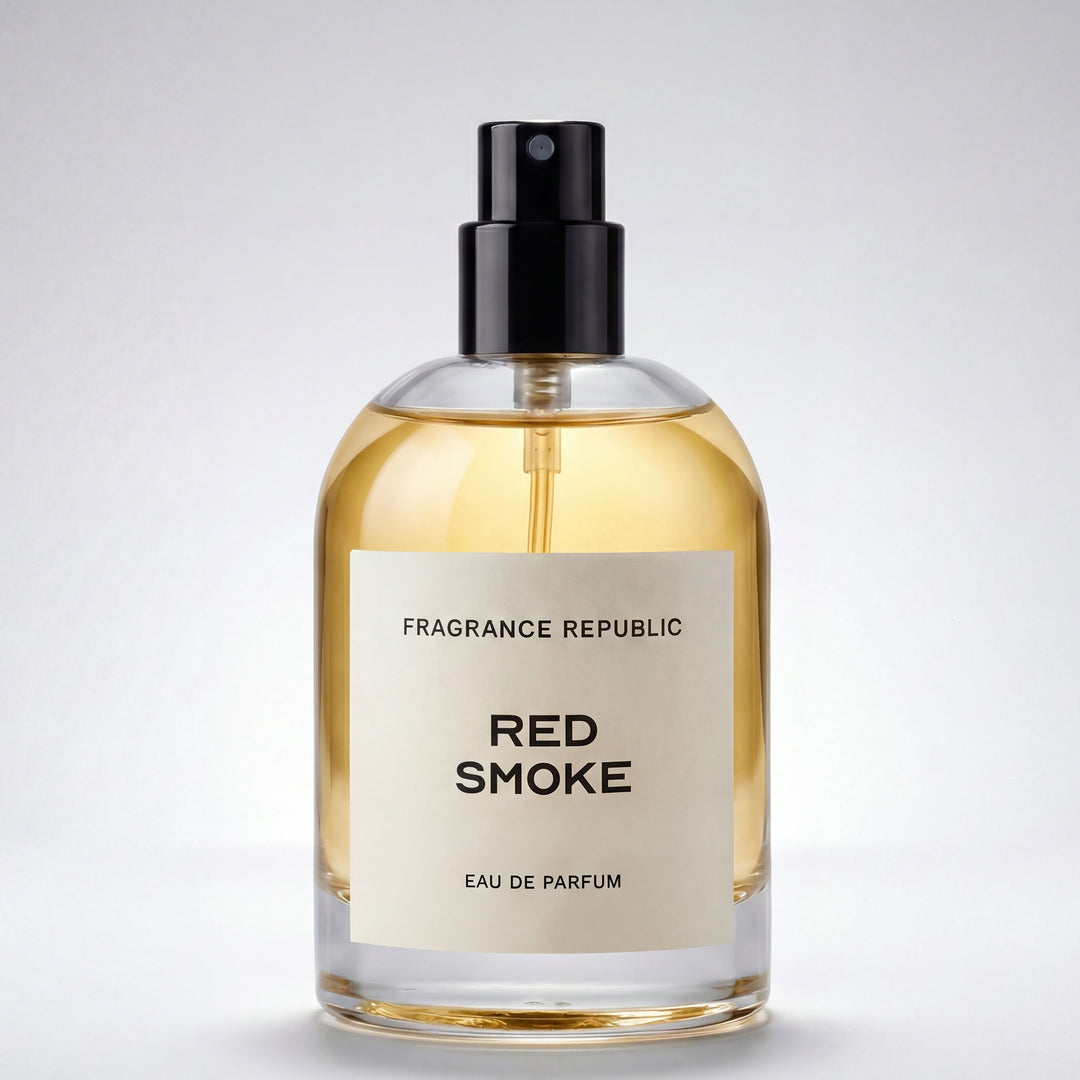 Clear glass bottle of Red Smoke eau de parfum with black spray cap on white background