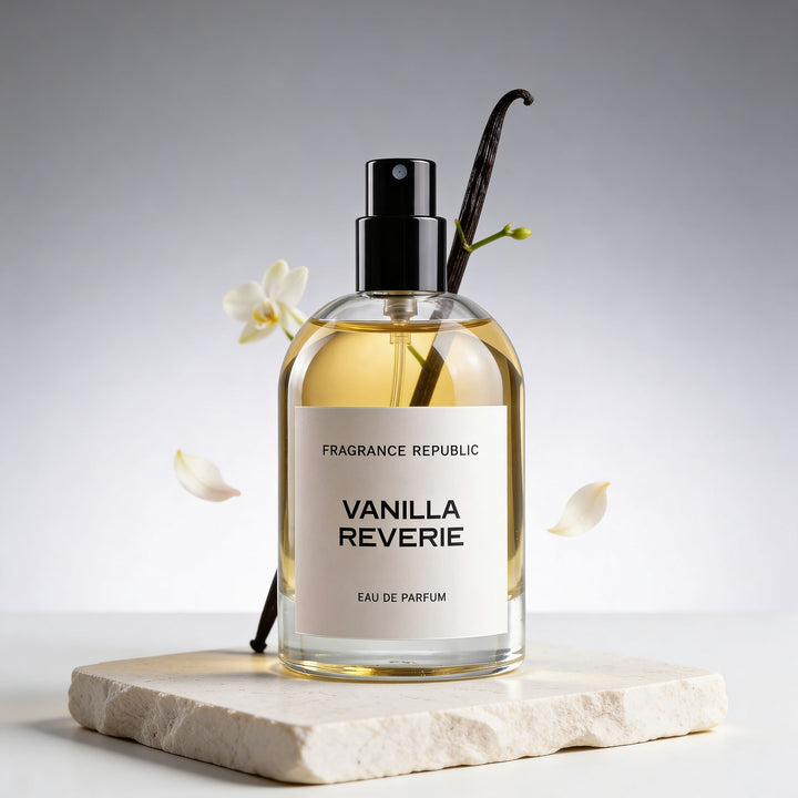 Vanilla Reverie eau de parfum bottle with vanilla bean and orchid flowers on stone platform