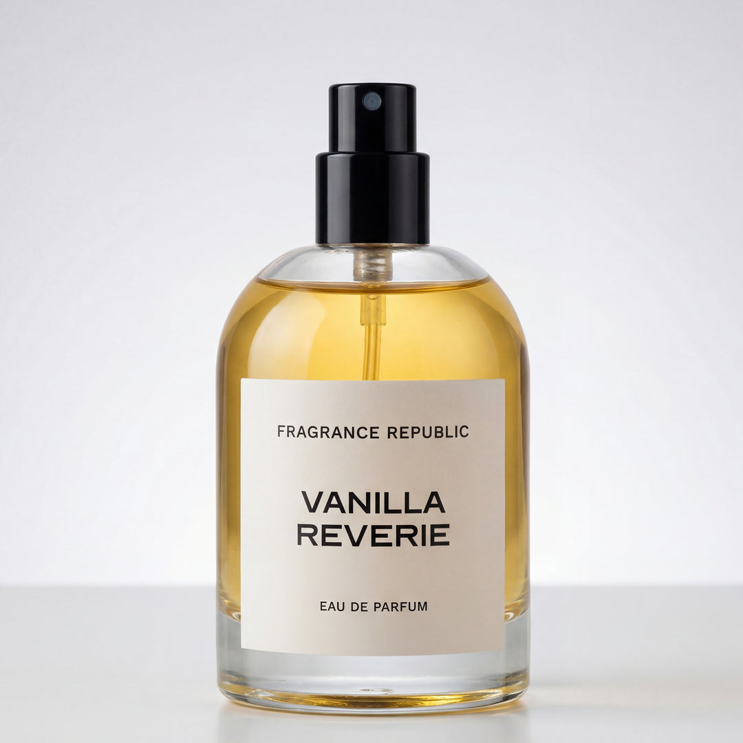 Clear glass spray bottle of Vanilla Reverie eau de parfum with amber liquid on white background