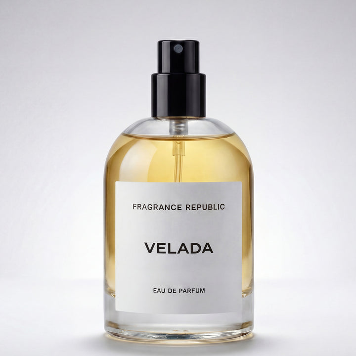 Clear glass bottle of Velada eau de parfum with black atomizer and minimalist label