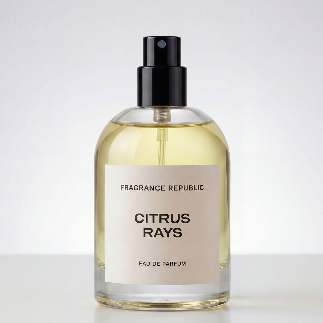 Clear glass perfume bottle with black spray cap labeled 'Citrus Rays Eau de Parfum'