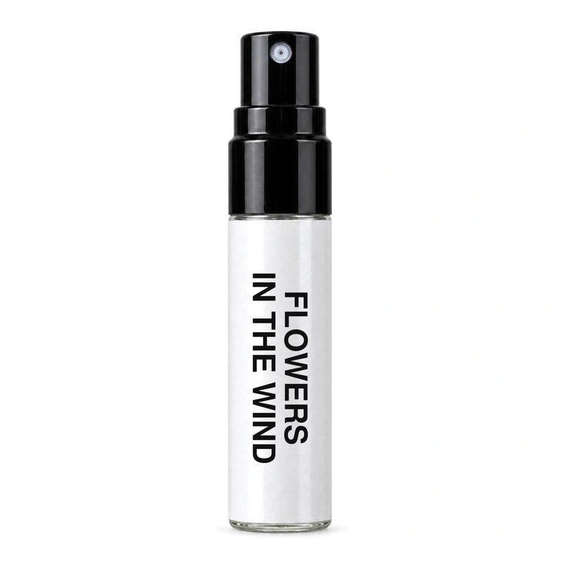 Fragrance Republic Flowers In The Wind sample perfume spray with its black nozzle and white label.