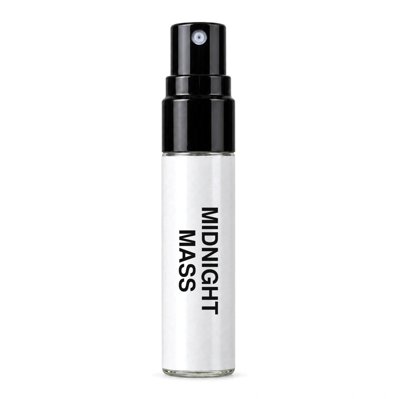 Fragrance Republic Midnight Mass sample perfume spray with its black nozzle and white label.